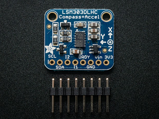 Top down view of  a Triple-axis Accelerometer+Magnetometer (Compass) Board above a 8-pin header. 