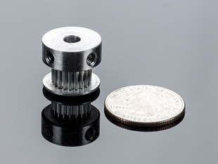 Aluminum Timing Pulley next to quarter