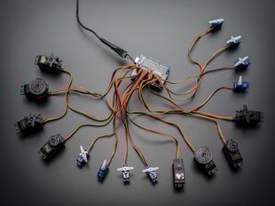 Top down view of a Adafruit 16-Channel 12-bit PWM/Servo Shield - I2C interface connected to 16 servos. 
