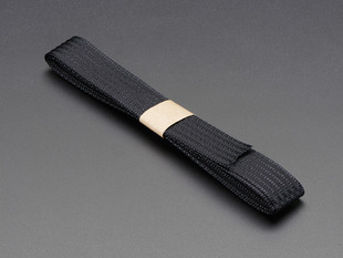 Angled shot of a black conductive thread ribbon cable.