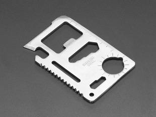 Credit-card sized metal sheet with many tool shapes stamped out of it