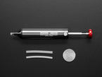 Kit Shot of the Engineer Professional Silicone-Tip Solder Sucker with included (x2) extra tubes next to a U.S. Quarter for Scale.