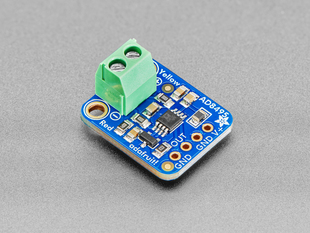 Angled shot of blue, square thermocouple amplifier breakout board with a pre-soldered green terminal block.