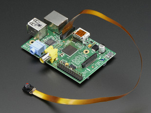 Angled shot of Spy Camera for Raspberry Pi connected to a Raspberry Pi via the CSI bus.