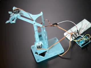 Robot arm moving around and opening/closing the grabber.