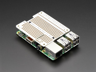 Angled shot of Adafruit Perma-Proto HAT for Pi Mini Kit on a Raspberry Pi.