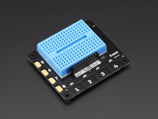 Angled shot of Pimoroni Explorer HAT for Raspberry Pi with a blue mini breadboard.
