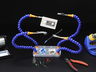 Super Fancy Third Hand Kit from Hobby Creek with Four Arms holding up a PCB