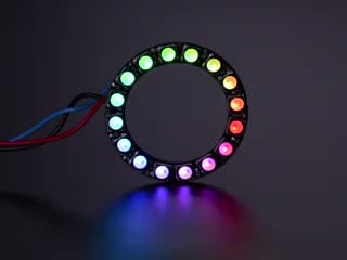 NeoPixel Ring with 16 x 5050 RGBW LEDs lighting up rainbow and white