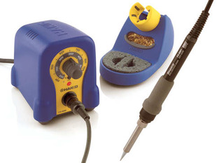 Two piece adjustable soldering iron with blobby temperature adjustable body and separate fancy holder