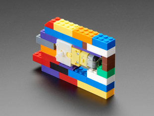 TT Motor with bracket installed into a Lego brick wall