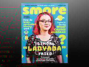 Topdown shot of Smore magazine cover. A bespectacled white woman, Limor Fried a.k.a. Ladyada, in black clothes with pink, shoulder-length hair is on the cover.