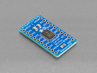Angled shot of blue, rectangle-shaped logic level converter.