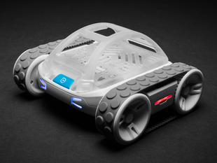 Angled shot of four-wheeled robot rover with LED eyes.