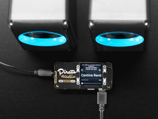 Pimoroni Pirate Audio: 3.5mm Line-out for Raspberry Pi connected to a set of speakers. 