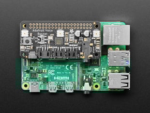 Top down view of a Adafruit Voice Bonnet for Raspberry Pi connected to a Pi/