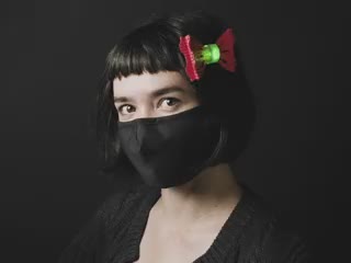Woman with assembled DIY Light Up Blinky Bow Ties as hairband