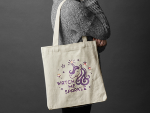 Person with completed DIY Watch Me Sparkle Light-Up Tote Bag Kit slung over sholder