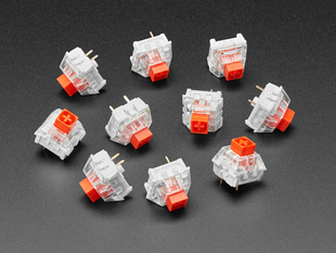 Angled shot of ten red Kailh key switches.