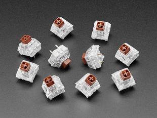 Angled shot of ten brown Kailh key switches.