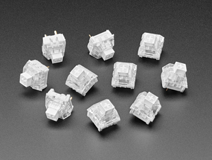 Angled shot of ten white Kailh key switches.