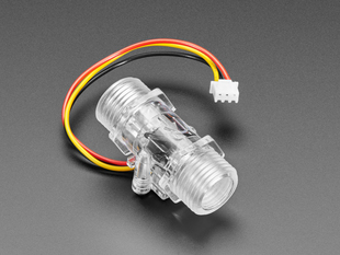 Angled shot of clear turbine flow sensor.