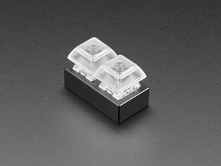 Angled shot of 2-key aluminum keypad shell assembled with Kailh key switches and clear keycaps.