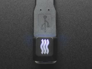 Close-up video of Zener ESP Waves keycap glowing rainbow colors.