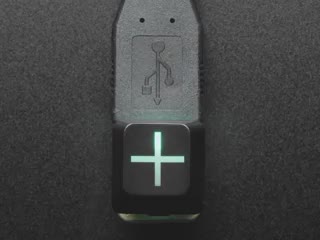 Close-up video of Zener ESP Plus keycap glowing rainbow colors.