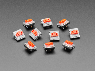 Angled shot of 10 red Kailh Choc V1 key switches.