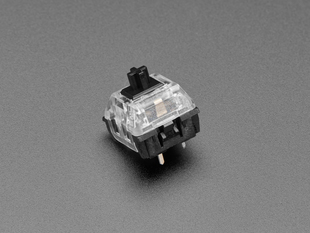 Angled shot of single black Kailh key switch.