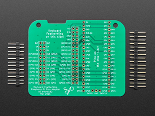Top view of Raspberry Pi Pico Adapter for Keyboard FeatherWing betwee two pieces of 0.1" headerl