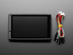 Top view of ESP32-S2-HMI-DevKit-1 next to debug cable.