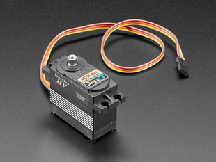 Angled shot of black servo motor with 3-pin jumper cable.
