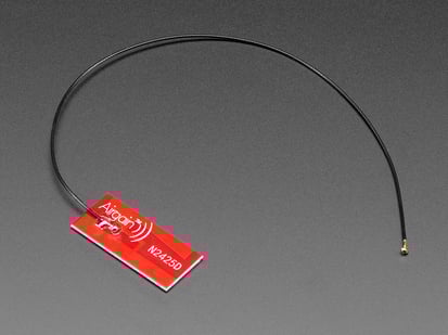 Angled shot of red rectangular antenna with wFL connector.