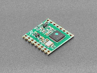 Angled shot of green LoRa radio module.