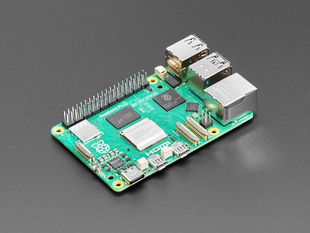 Angled shot of green Raspberry Pi 5 microcontroller.