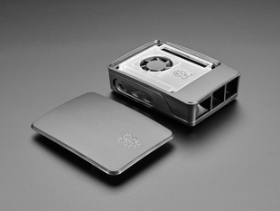 Angled shot of disassembled black and gray, rectangular microcontroller case.