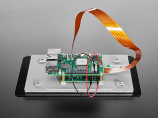 Close-up of FPC ribbon cable connecting a Raspberry Pi to a 7" touchscreen.