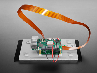 Close-up of FPC ribbon cable connecting a Raspberry Pi to a 7" touchscreen.
