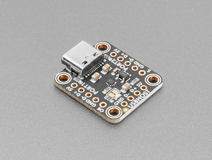 Angled shot of black, square breakout board with a USB-C connector.