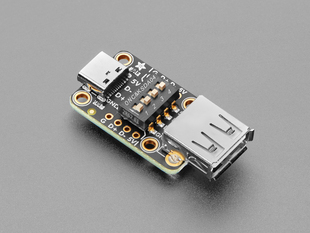 Angled shot of black, rectangular USB A to USB C breakout board. 