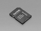 Angled shot of black SD card with a microSD card.