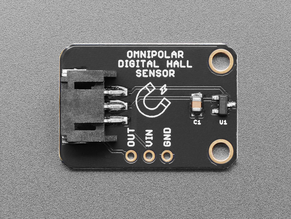Overhead shot of black, rectangular hall sensor breakout board.