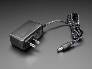 Wall wart power supply with 2.1mm DC output.